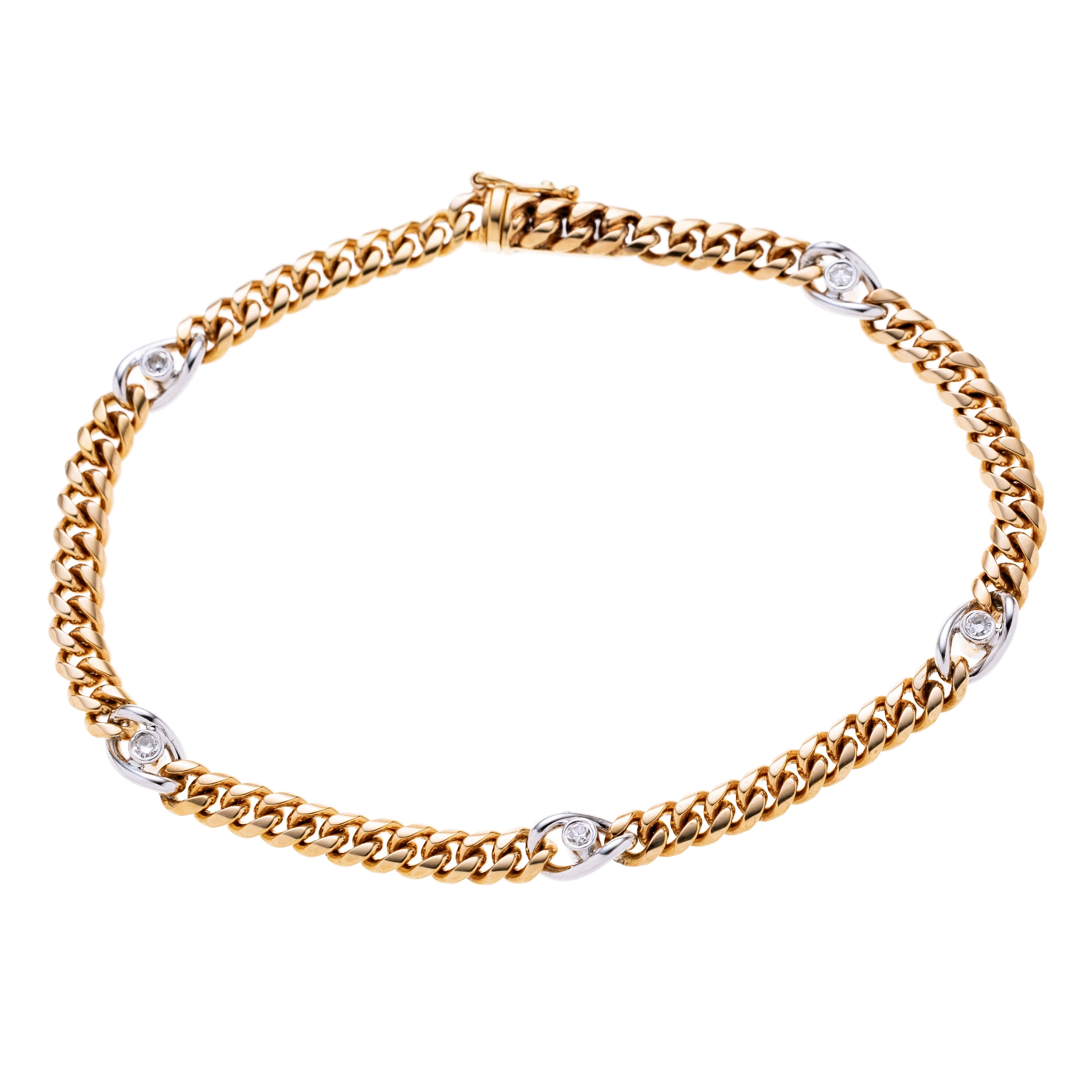Gelbgoldenes Panzerarmband mit fünf Weißgoldgliedern die je mit einem ca. 0.02 ct. Diamanten besetzt sind.