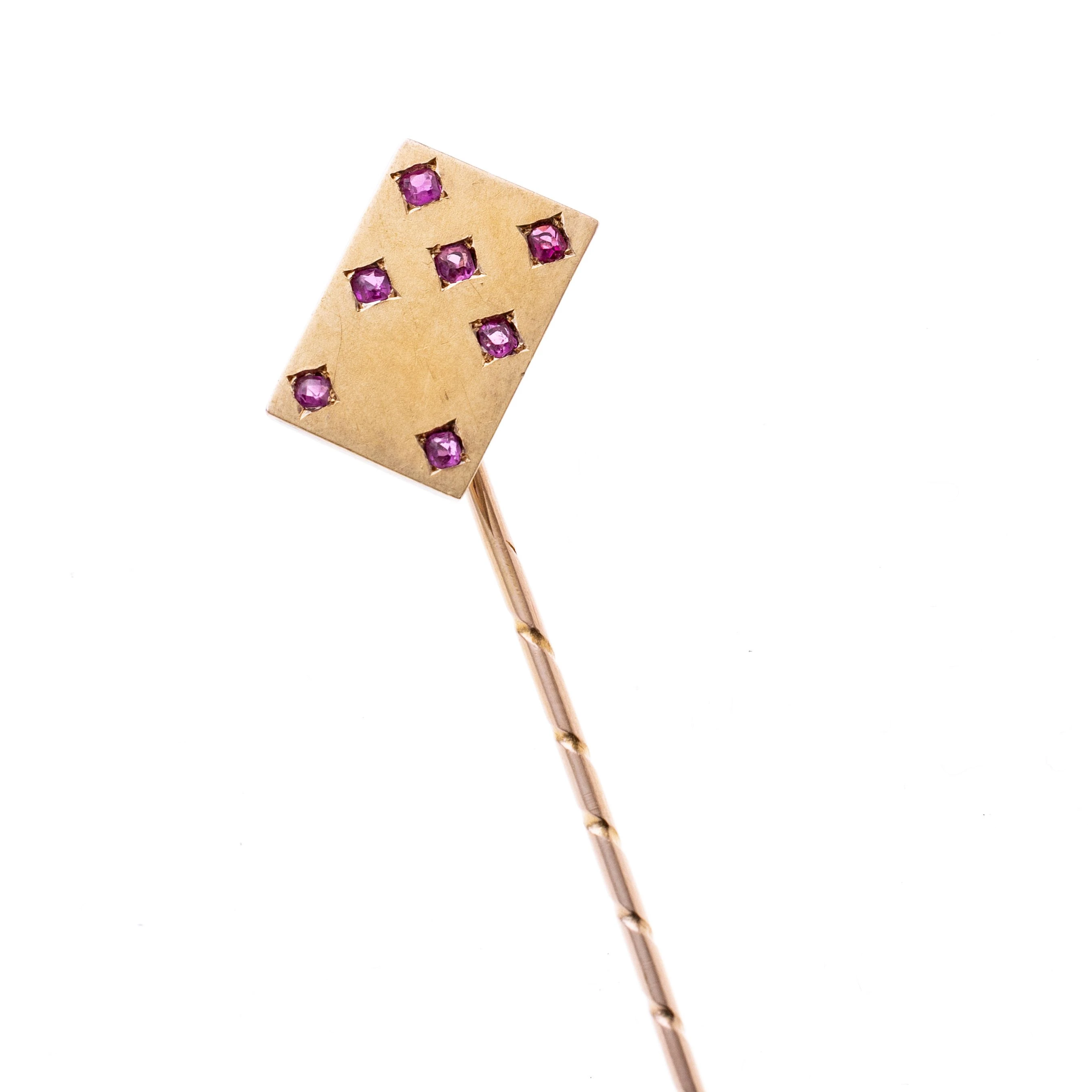 Eine Spielkarte besetzt mit sieben Rubinen je ca. 0.02ct