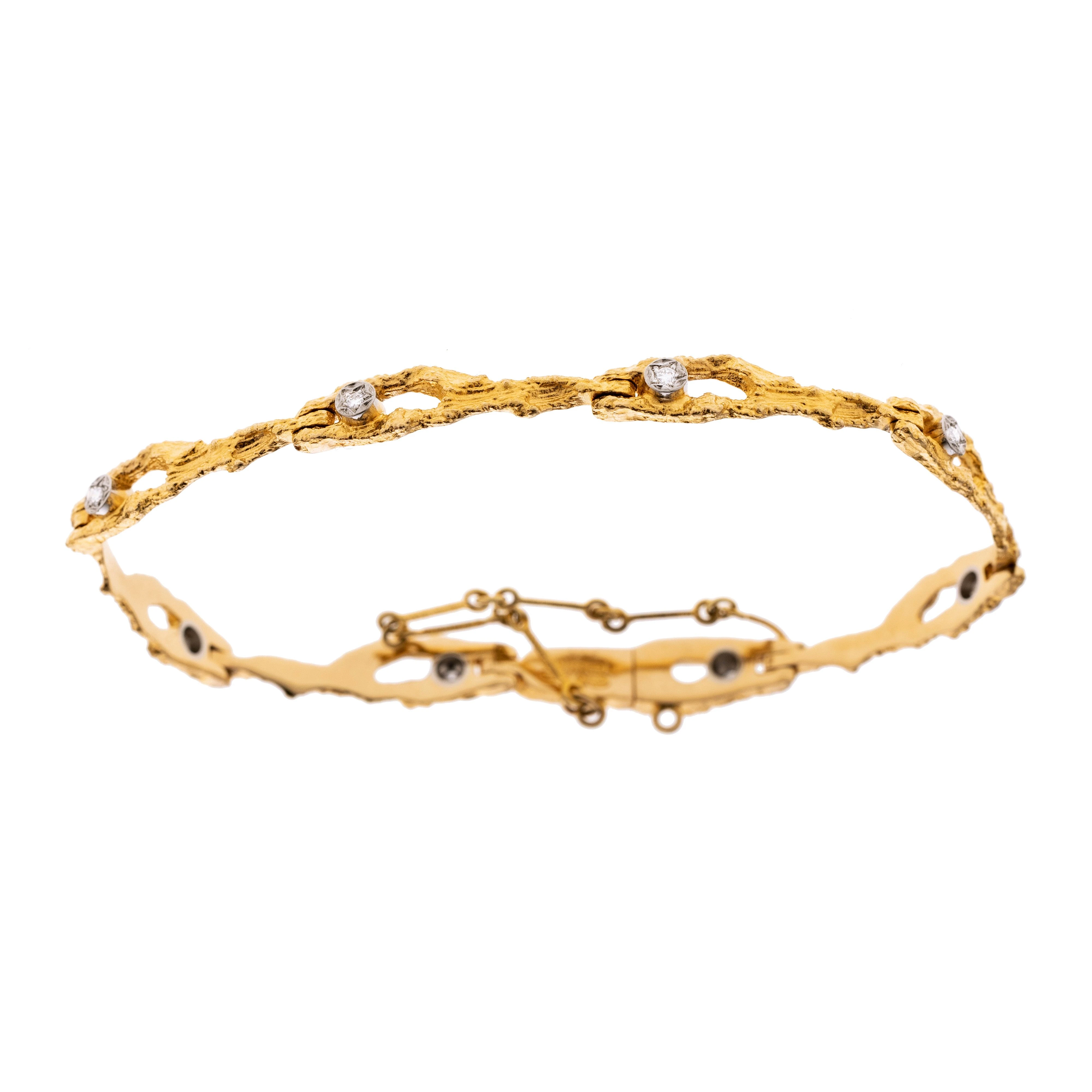 Ein Armband, punziert Lapponia, gefertigt aus 750/- Gelbgold. 8 Elemente mit je einem Brillant in einer Weißgold-Zargenfassung. Feines Kastenschloss. Sicherheitskettchen.
